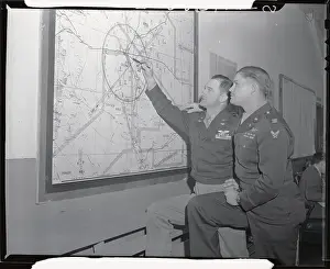 Military Men Working on Mounted Map