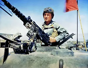 Military Officer Standing in Tank