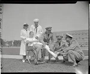 Military Officers with Patient in wheelchair