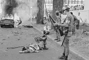 War Victim Prints: Military Police with Bombing Victim in Saigon