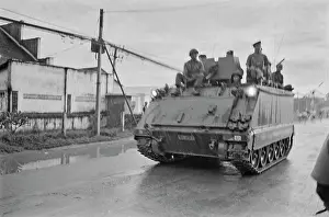 Prints of Military personnel on an M113 armoured personnel carrier driving through Saigon, Vietnam, 30th August 1965 Vietnam Prints: Military In Saigon