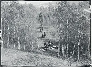 Military Students Riding Horses Through Landscape