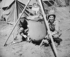 Military Women Sitting at Water Holder