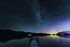 John Finney Photography Gallery: The Milky Way and Aurora Borealis from a jetty over Derwent water. English Lake District. UK