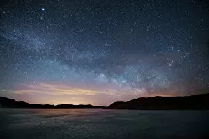 Images Dated 27th February 2017: Milky Way floats above frozen lake, Front Range, Colorado, USA