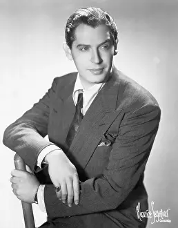 Milton Berle Seated In A Chair