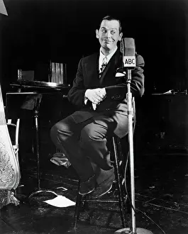 Milton Berle Seated On Stool