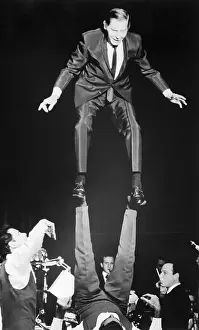 Balancing Prints: Milton Berle Stands On Acrobat'S Feet
