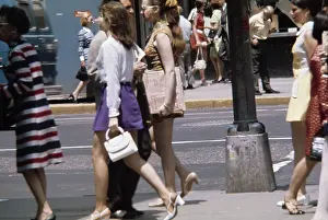 Prints of Women wearing mini skirts and mini dresses in a street at an unidentified location in the United States, circa 1970. (Photo by UPI/Bettmann Archive/Getty Images) Fashion Trends Through Time Prints: Mini Skirt Fashions