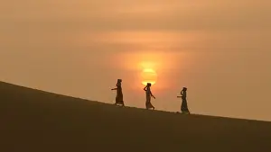 Minority Cham Girls on Sand Dune in beautiful sunsire / dawn
