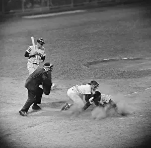 Minoso Sliding Into Home Plate