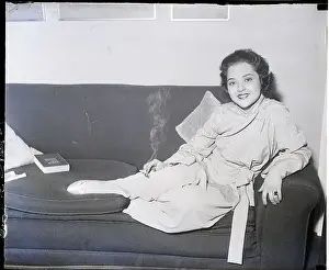 Miriam Battista Seated on Couch Smoking
