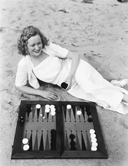 Miriam Hopkins Plays Backgammon on Beach