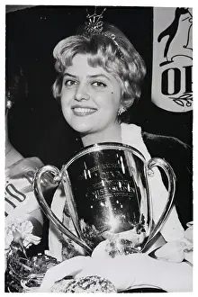 Contestant Prints: Miss Finland Smiling And Holding Cup