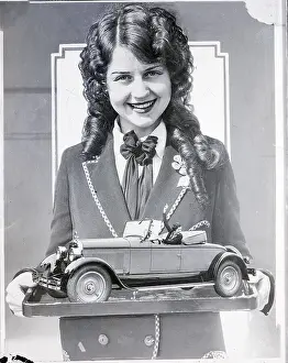Miss L.A. Adrienne Dore Holds Model Car