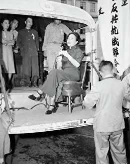 Nationalist Prints: Mme. Chiang Seated In Bus Holding Mic