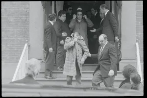 Shame Prints: Mobster Guard Peter Diapoulos Hiding His Face Outdoors