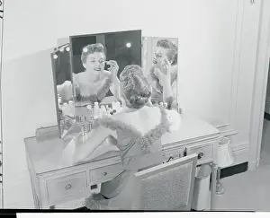 Model Making up Her Face at Vanity Table