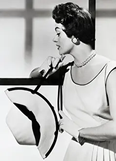 Panama Prints: Model Manipulates Panama Hat Into A Bag