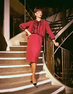 Model Posing Orange Satin Cocktail Dress