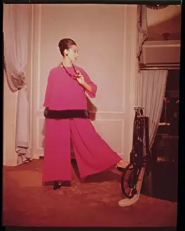 Mink Prints: Model Posing in a Red Mink Lined Outfit