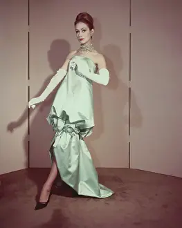 Model Posing in Satin Evening Gown
