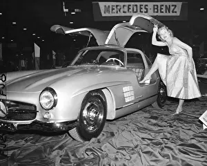 Prints of (Original Caption) 2/5/1954-New York Vintage Car Collection Prints: Model Standing By German Sports Car