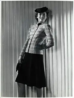 Plaid Prints: Model Wearing Black Dress with Plaid Coat