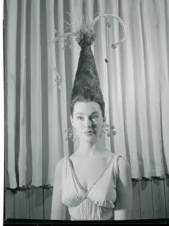 Model Wearing Unusual and Piled High Hairdo