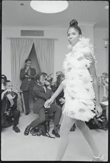 Fashion Runway Prints: Model Whisks By Audience All In Feathers