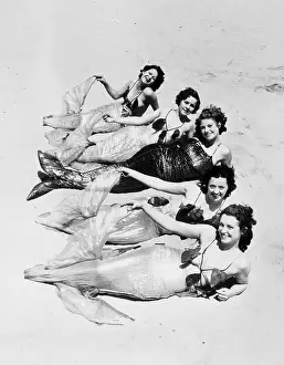 Reclining Prints: Models Dressed as Mermaids for Neptune's Extravaganza in California
