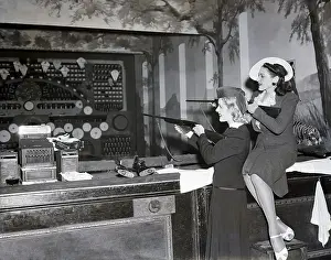 Amusement Park Prints: Two Models Shooting At Amusement Park