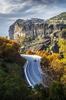 Thessaly Prints: Monasteries perched on cliffs and a winding road in autumn foliage