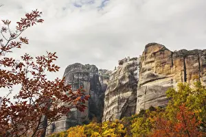 Thessaly Prints: Monastery perched on a cliff with autumn foliage