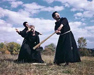 Monks Playing Baseball in Field