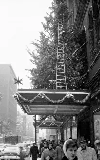 Prints of On the busy St. Catherine Street, harried shoppers battle winds and snow to purchase last minute gifts a few days before Christmas, Montreal, Quebec, Canada, December 1957 Celebrate the Season: A Curated Collection of Christmas Art: Montreal Pedestrians At Christmastime