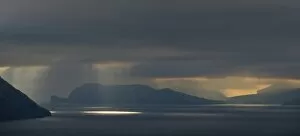Mood light with low-hanging clouds, Koltur and Vagar islands, Faroe Islands, Denmark