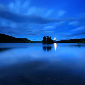 Moonrise crannog loch hill glen night Scotland