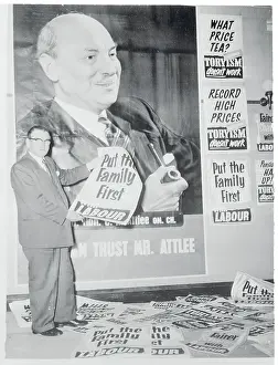 Prints of (Original Caption). Laborites Get Set for Battle A Quiet Strength: A Leader Who Shaped Modern Britain: Morgan Phillips Holding a Campaign Poster