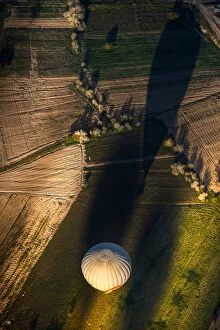 Morning balloon over the field in aerial view