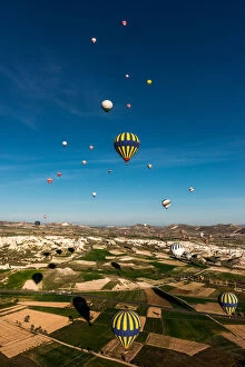 Morning balloons over Cappadocia landscape