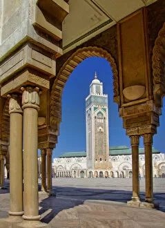 Images Dated 12th July 2013: Mosque of Hassan II and minaret through the arches of the square outside it in Casablanca