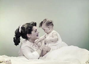 Casual Collection: Mother with baby, smiling