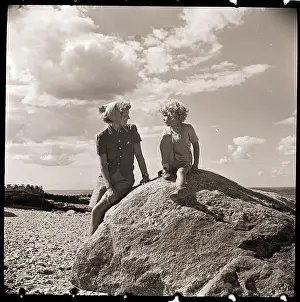 Mother and Child on Rock at Beach