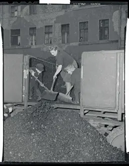 Difficult Prints: Mother and Children Shoveling Coal