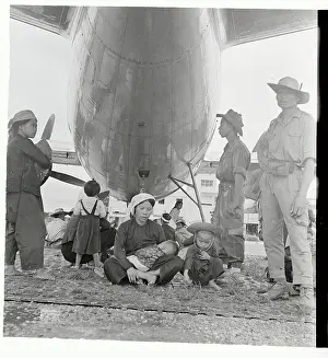 Hanoi Prints: Mother and Children Waiting to Board a Plane