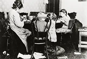 Mother and Children During Work at Their Table