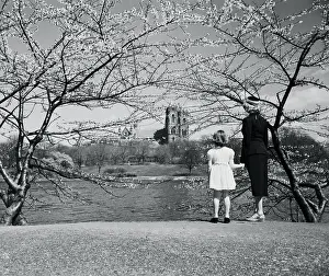 Baby Girl Prints: Mother and daughter (8-9 years) looking at view