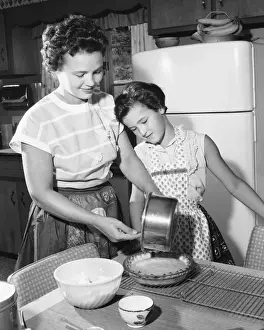 Homemade Prints: Mother and daughter making pie