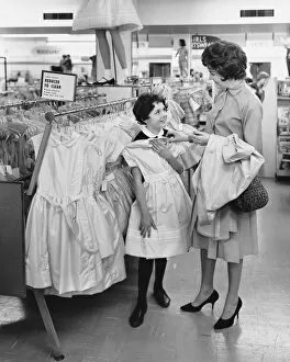 Mother and daughter shopping for clothes